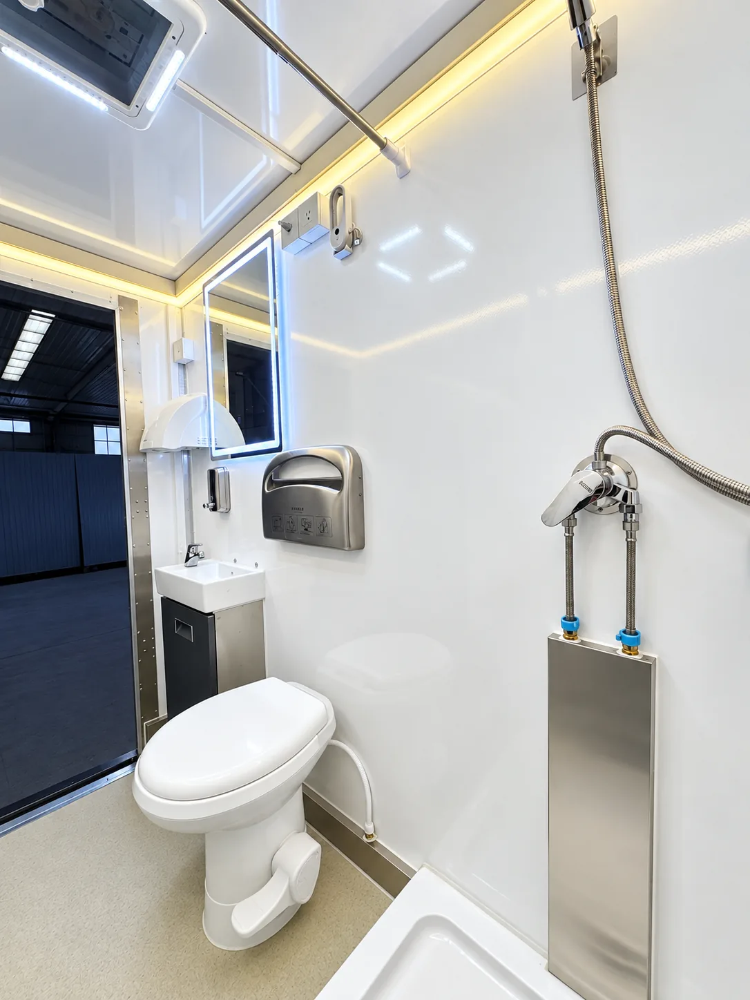 Luxury shower and restroom combination trailer interior