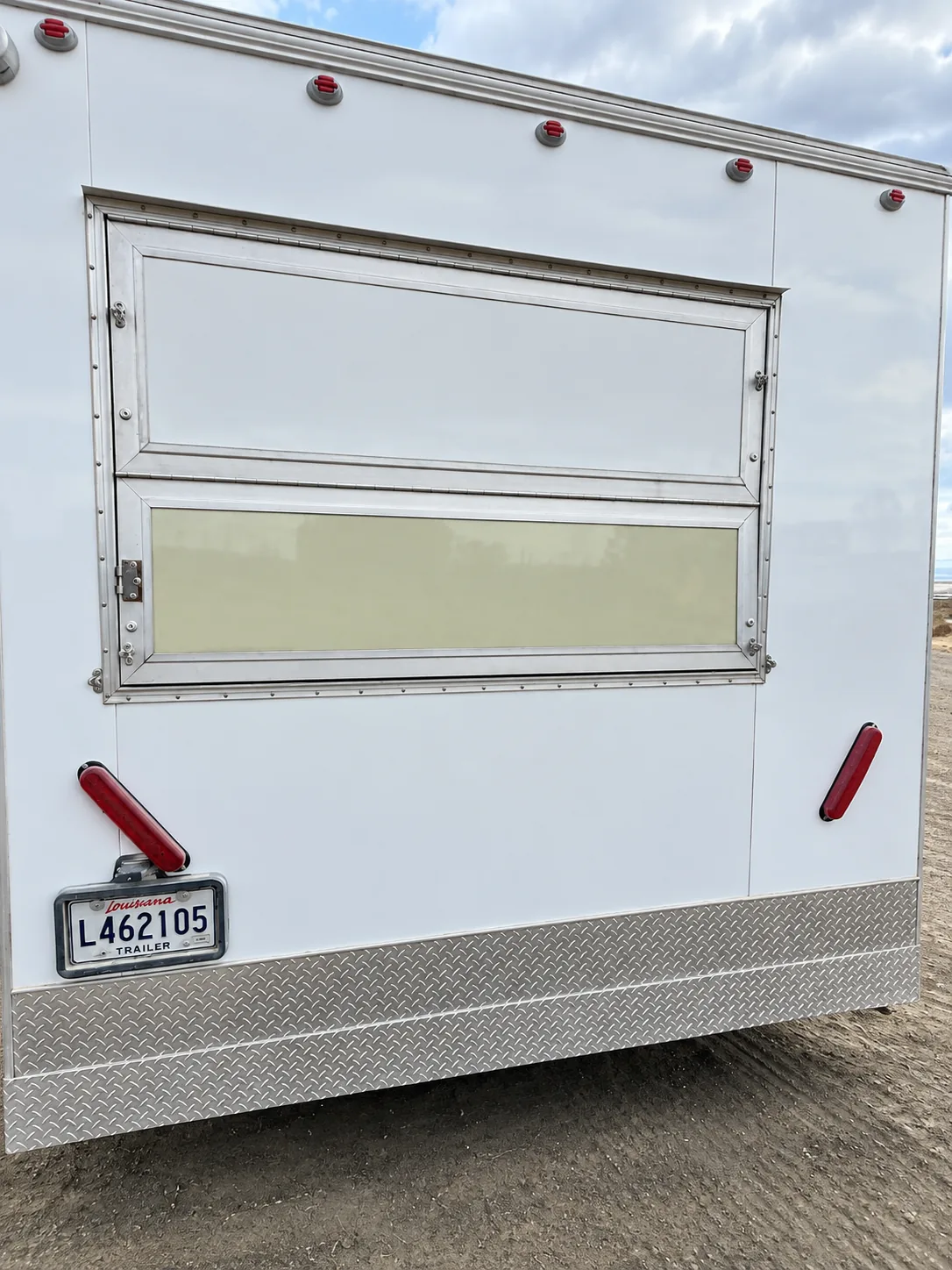 Mobile commercial kitchen trailer exterior with service window
