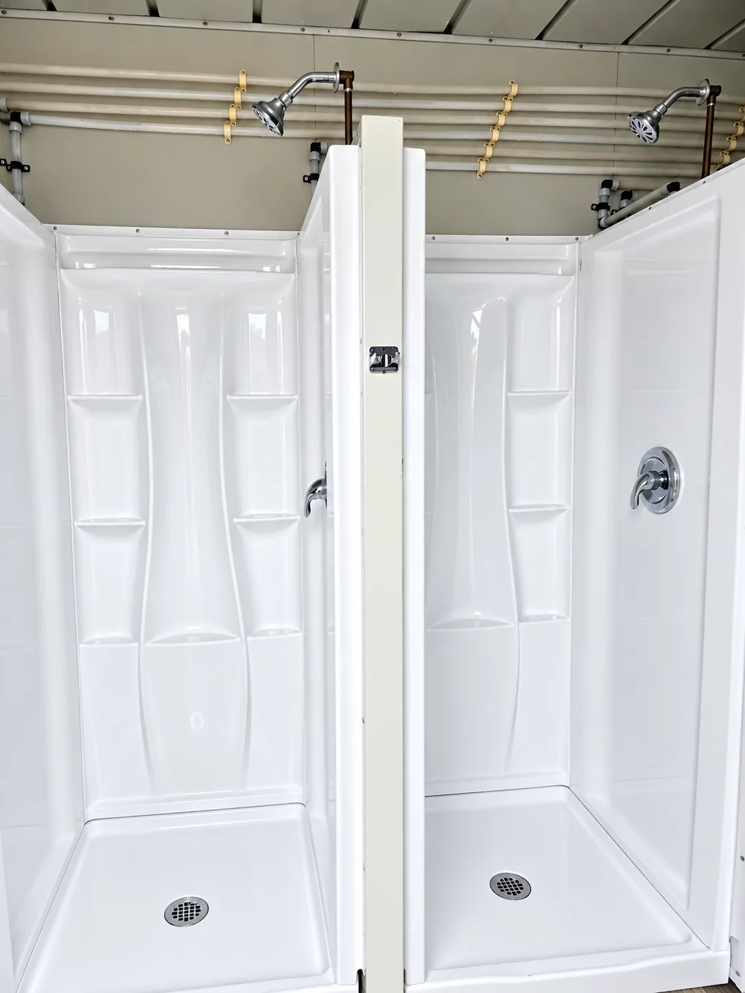 Private shower stall inside a temporary shower container